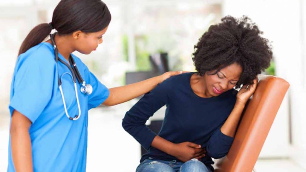 Woman discussing possible abortion risks with a healthcare professional.