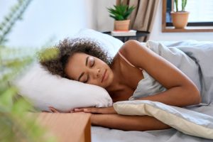 Abortion recovery tips woman lying peacefully in bed to rest