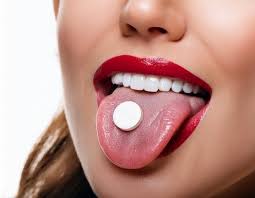 Woman taking an abortion pill sublingually